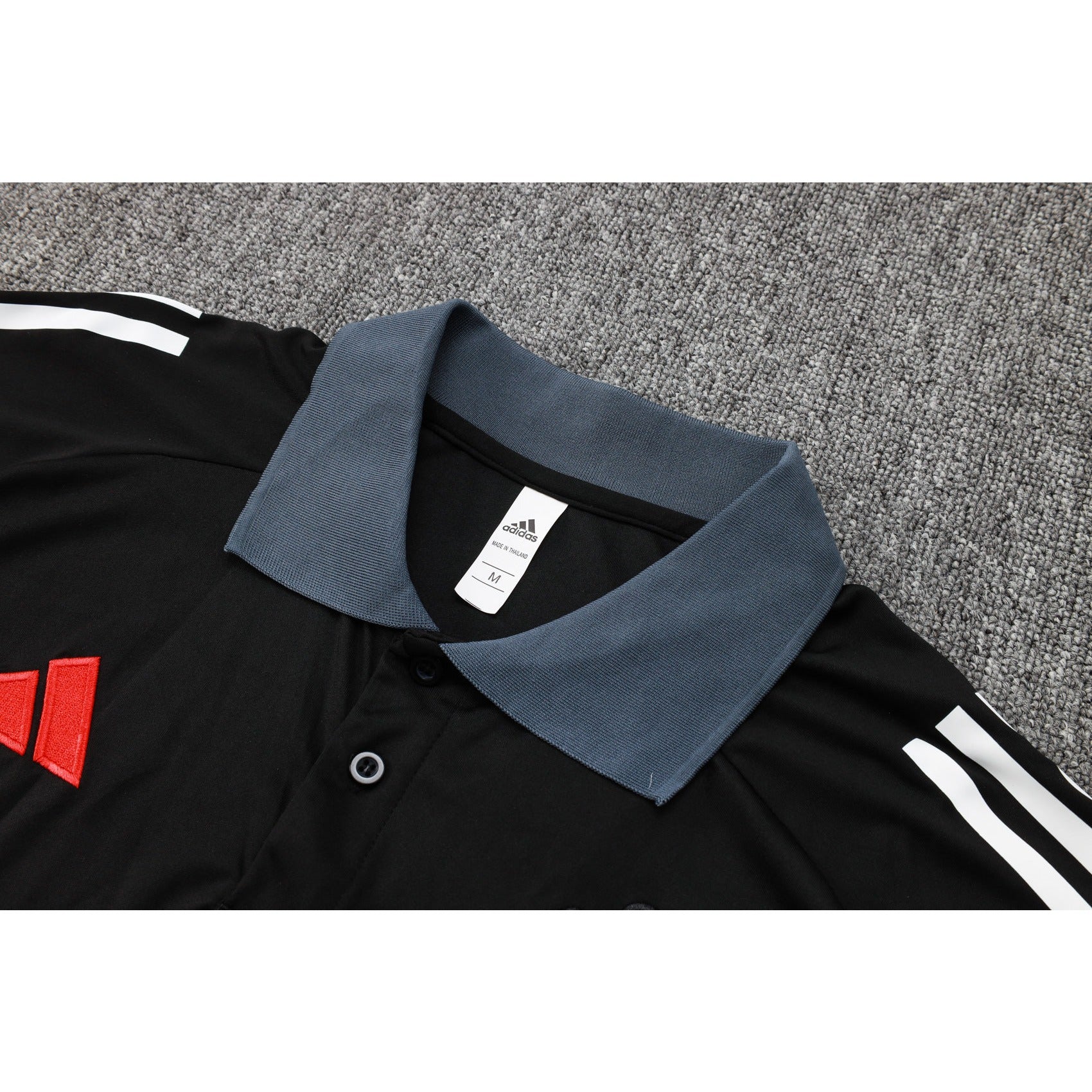 NEW MANCHESTER UNITED TRACKSUIT POLO 2º 24/25